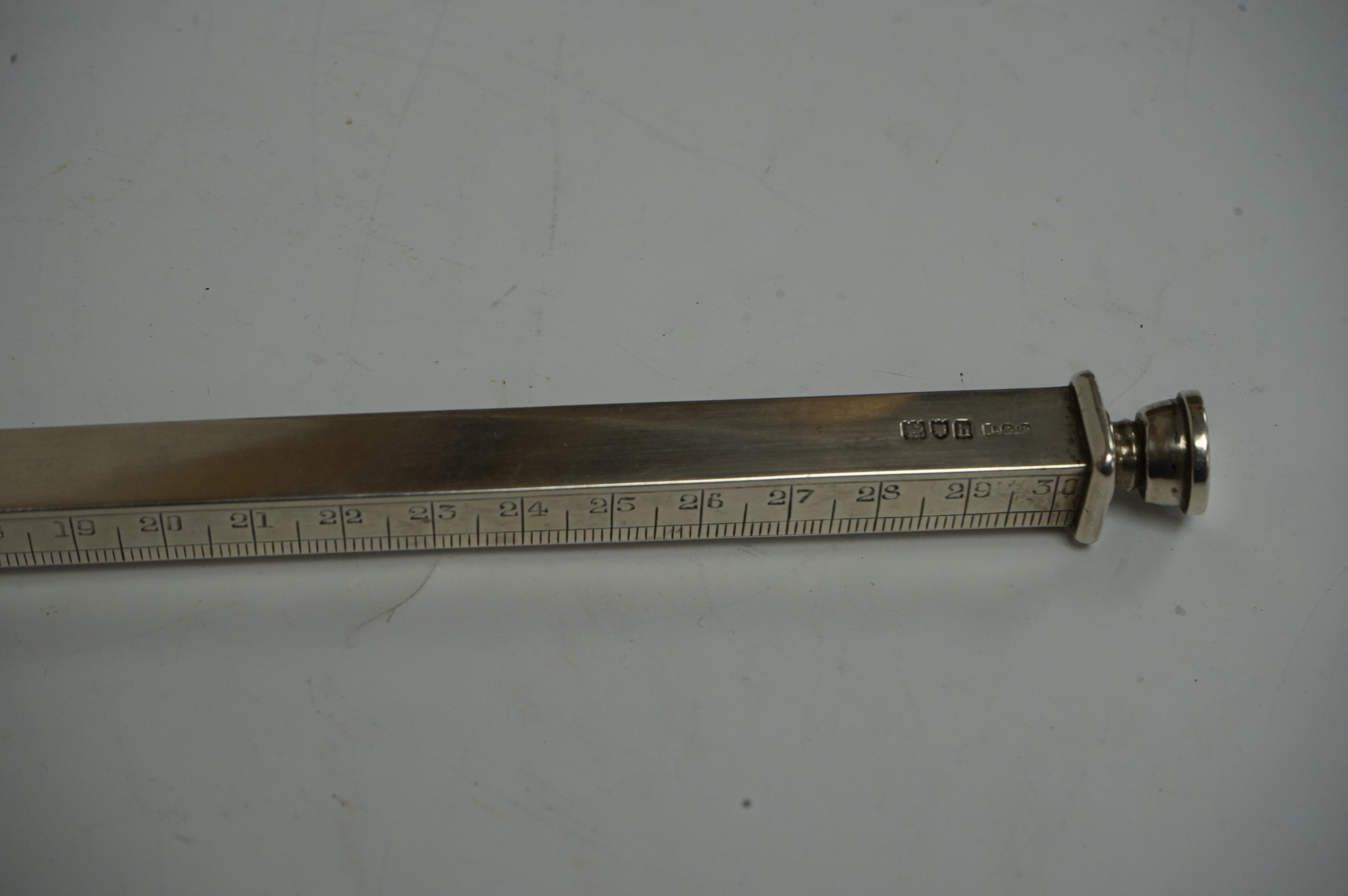 An Edwardian novelty silver twelve inch ruler and double ended pencil holder, by Jordan & Raybould, London, 1903, 33.5cm. Condition - fair to good